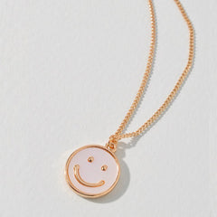Carita feliz sonriente perlada - dorada